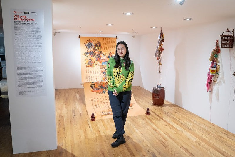 Artist Amanda Phingbodhipakkiya in the Pearl River Mart gallery with her exhibition
