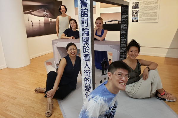Architect Philip Poon with members of the Pearl River Mart staff in Pearl River Mart's gallery
