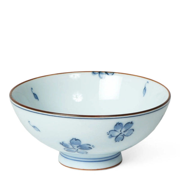 Ceramic bowl with blue floral patterns on a white background