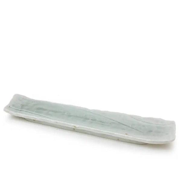 A long, narrow rectangular ceramic dish or tray with a pale celadon green glaze, shown on a plain white background.