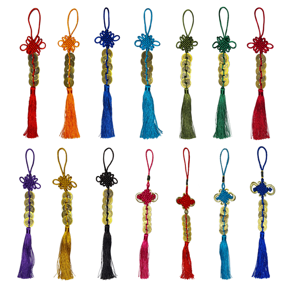 Collection of colorful tassels and decorative items on a white background