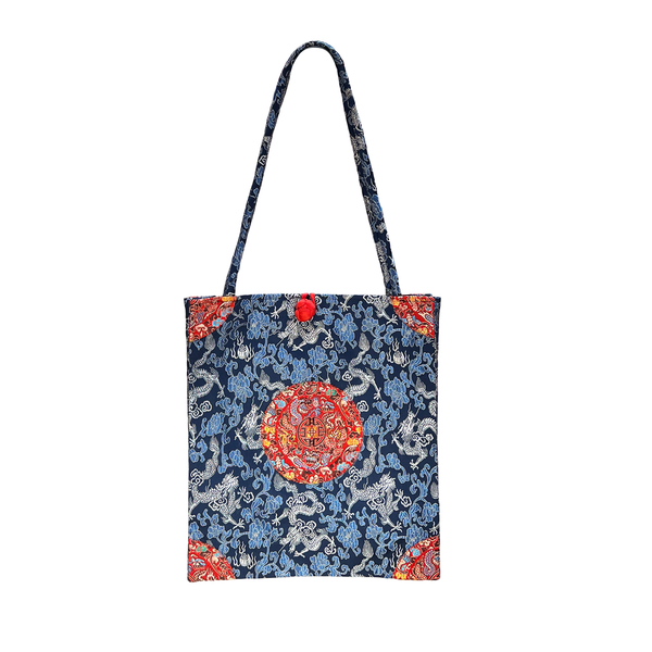 Tote bag with dragon design on a white background