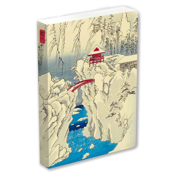 Notebook with a Japanese landscape design featuring a red bridge and mountainous scenery.