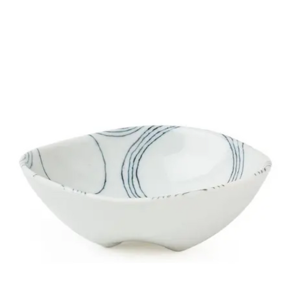 White ceramic bowl with blue patterns on a white background
