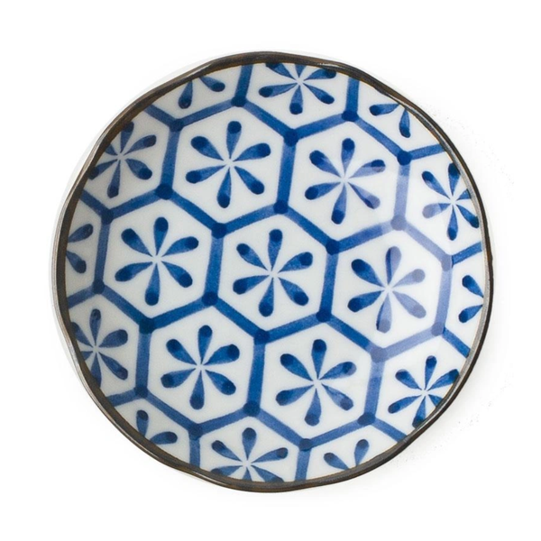 Ceramic plate with blue geometric pattern on a white background