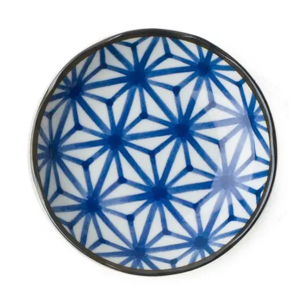 Ceramic plate with blue geometric pattern on a white background