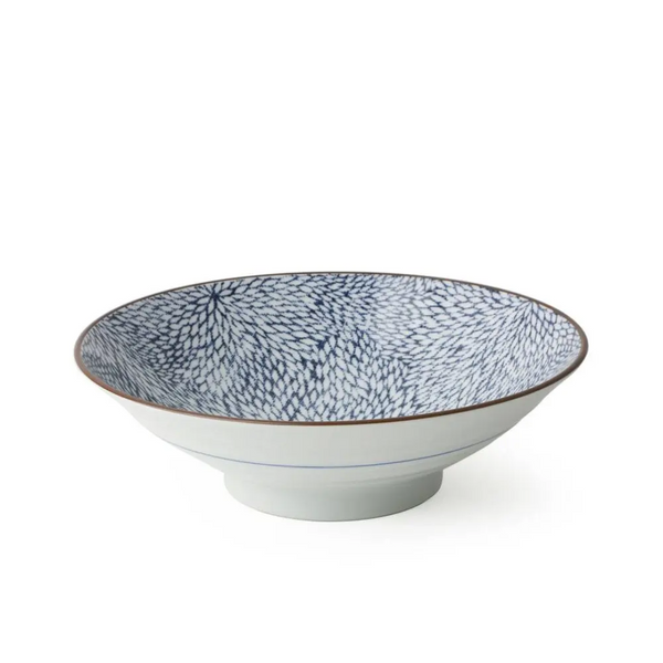 Ceramic bowl with blue speckled pattern on a white background