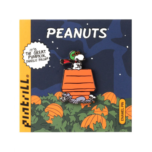 Peanuts enamel pin with Charlie Brown in a pumpkin patch on a blue background