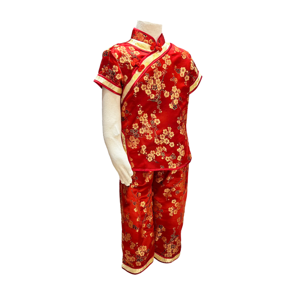 Traditional kids outfit in red with gold blossoms on mannequin