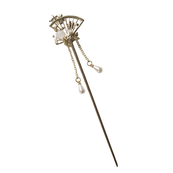 Decorative hairpin with fan design and pearls on a white background