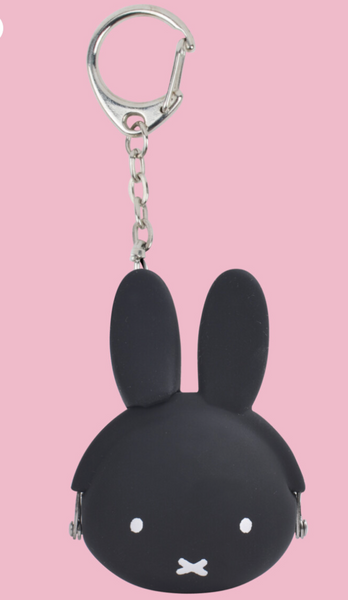 black miffy keyring coin pouch on a pink background