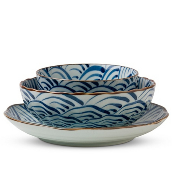 Stack of blue on white plate and two bowls