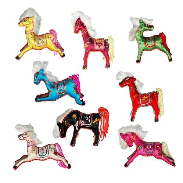 Colorful horse-shaped ornaments on a white background