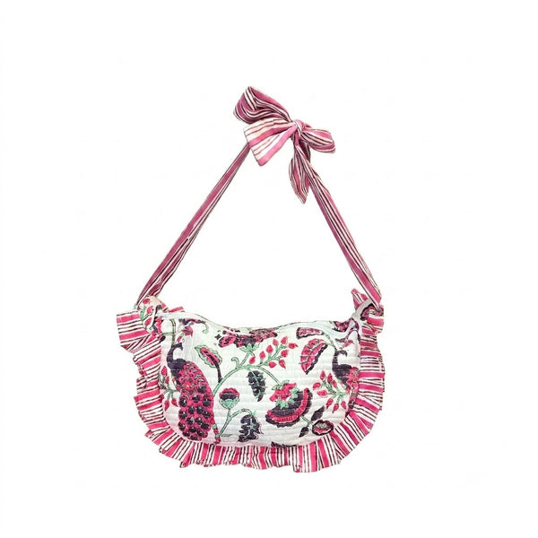 Pink and white purse with peacock and floral design on white background