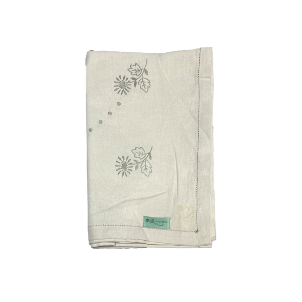 Folded tablecloth with flower design