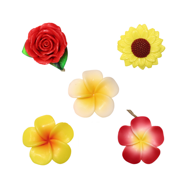Five flower shaped soaps: rose, sunflower, and yellow, white, and pink blossoms
