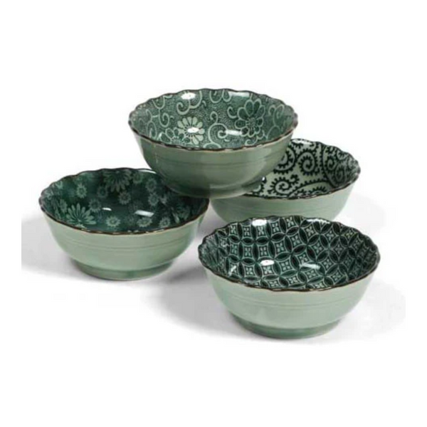 Set of four green ceramic bowls with patterned interior on a white background