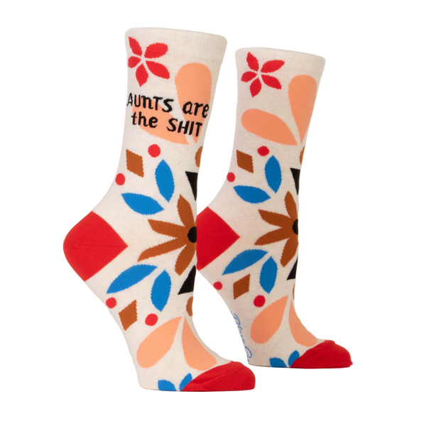 Cream color socks with text, colorful flowers, and red accents