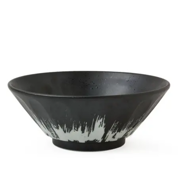 Black ceramic bowl with white design on a white background