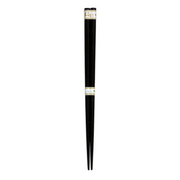 Black chopsticks with a gold band on a white background