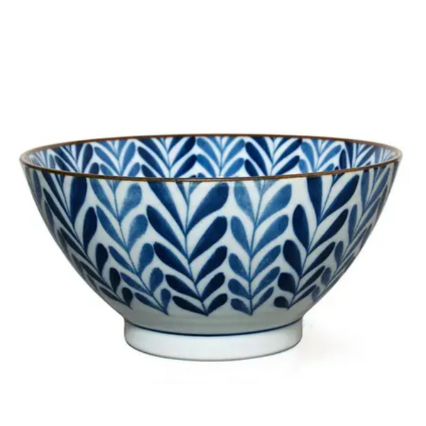 Ceramic bowl with blue leaf pattern on a white background