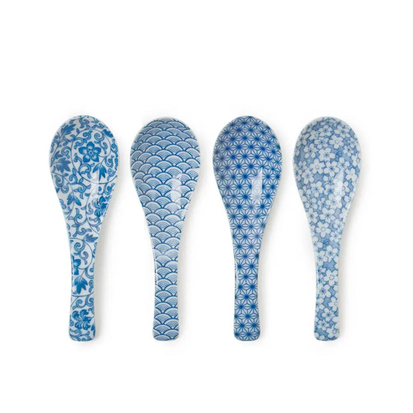 Four blue patterned spoons on a white background