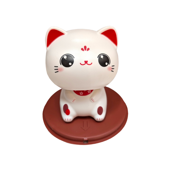 Cute lucky cat figurine on round brown stand