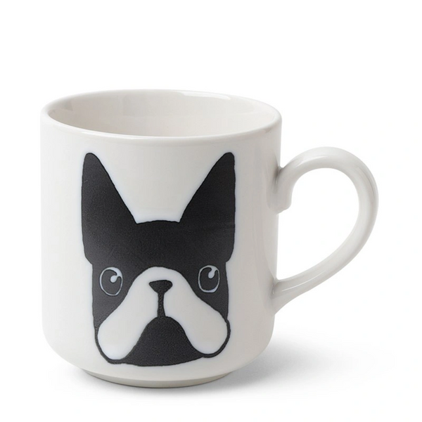 White mug with a black and white dog face design on a white background