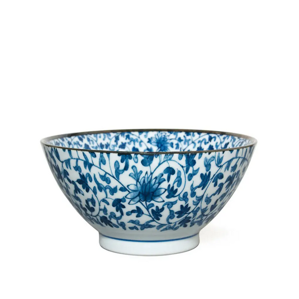 Ceramic bowl with blue floral patterns on a white background
