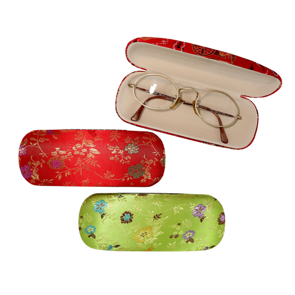 Three brocade eyewear cases, two red and one green, and one red open with glasses