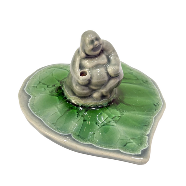 Laughing Buddha on leaf incense holder