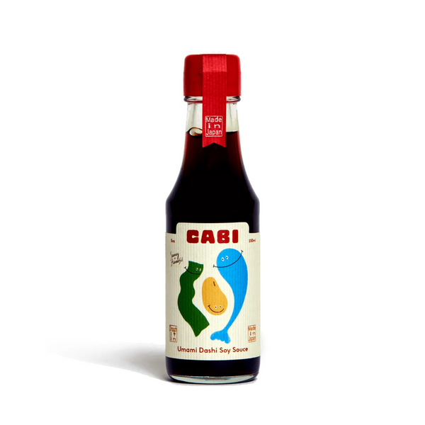 Bottle of Cabi Umami Dashi Soy Sauce on a white background
