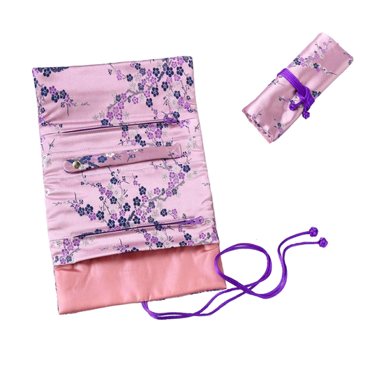 Pink brocade jewelry roll with blue and purple blossoms