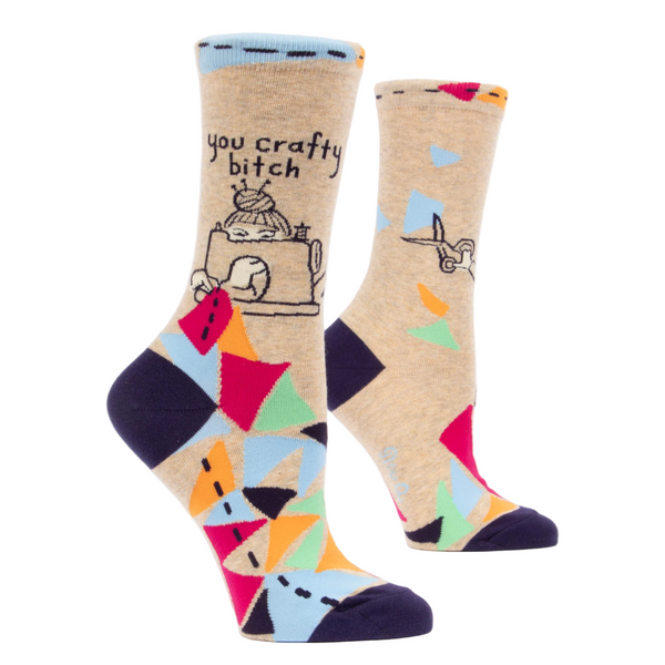 Colorful socks with geometric patterns and text on a white background