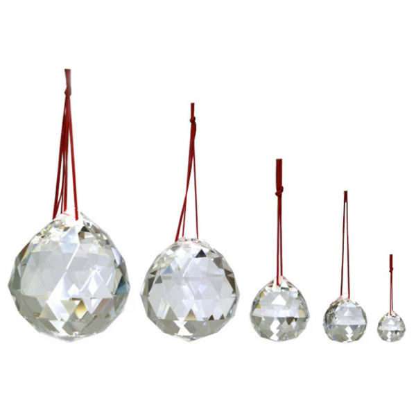 Five crystal balls with red strings attached. The balls are ranging from 20mm to 80mm