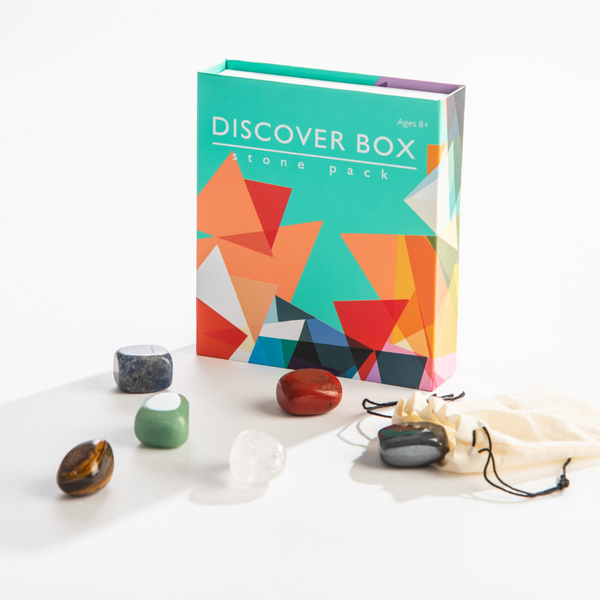Discover Box stone pack with colorful packaging and stones on a white background