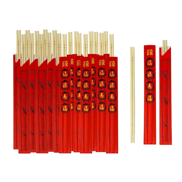 Disposable bamboo chopsticks in red paper sleeves with gold characters