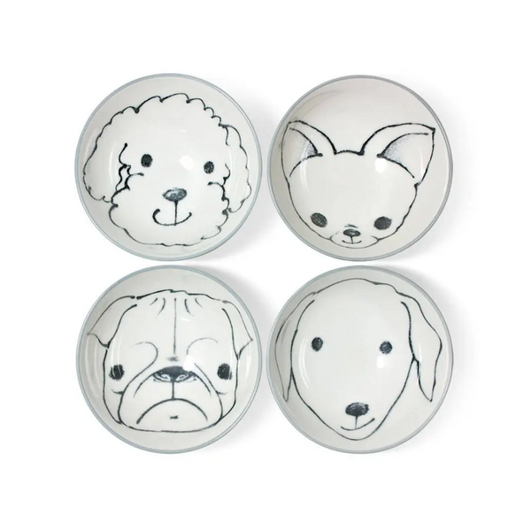 Four ceramic bowls with black line drawings of dog faces on a white background