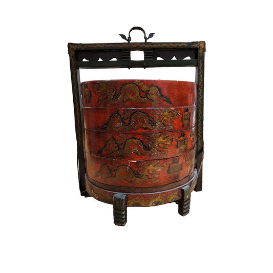 Decorative round wedding chest with intricate carvings on a white background