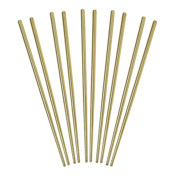 Set of gold metal chopsticks on a white background
