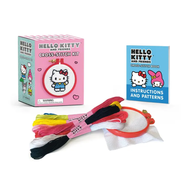 Hello Kitty cross-stitch kit with packaging, thread, scissors, and instructions on a white background