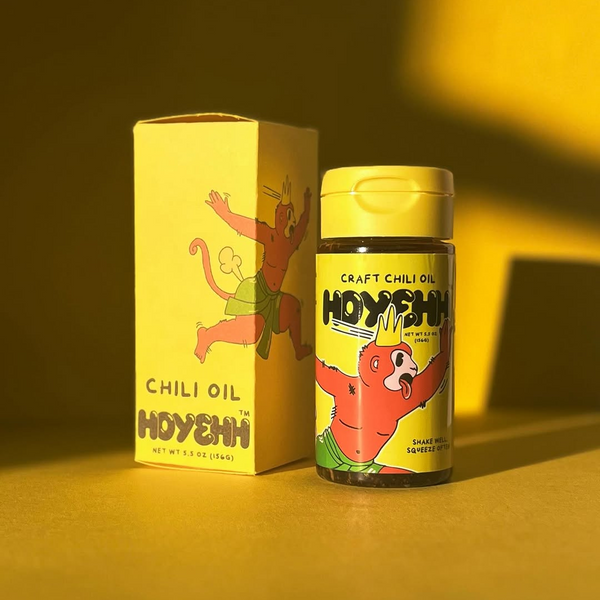 Hoyehh chili oil bottle and packaging on a yellow background