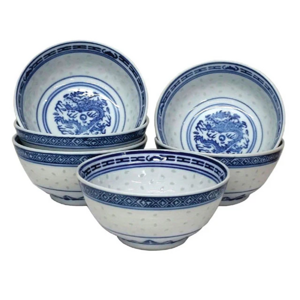 Set of blue and white ceramic bowls on a white background