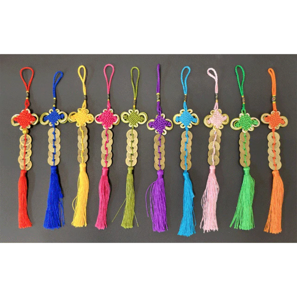 Five coin ornaments with tassels. Each ornament comes in a different color. From left to right, the colors go: Red, cobalt blue, yellow, fuchsia, sage green, purple, sky blue, pink, lime green, orange.. all of the ornaments hold five coins.