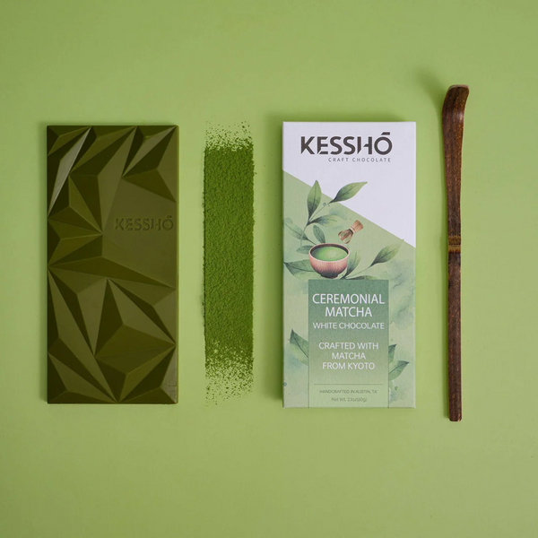 Kesshô ceremonial matcha white chocolate bar and packaging on a green background