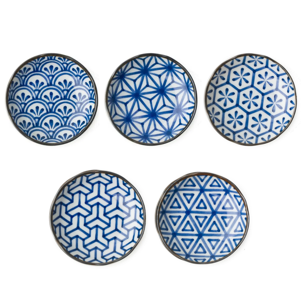 Set of six blue and white patterned ceramic plates on a white background