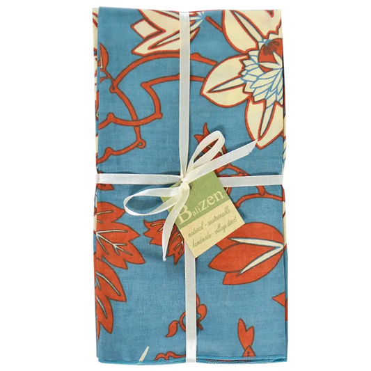 Floral-patterned napkin set with a white ribbon and a visible brand tag on a white background