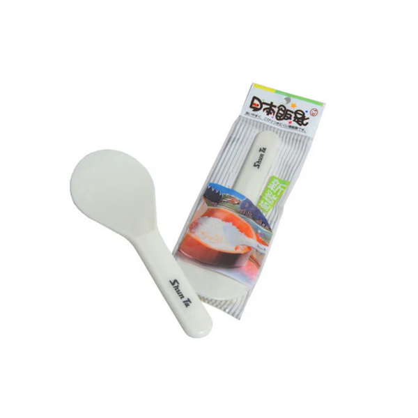 White rice paddle with packaging on a white background