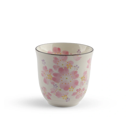 Ceramic mug with floral pattern on a white background