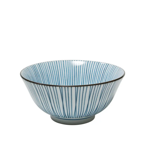Ceramic bowl with blue and white striped pattern on a white background